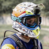 Rider wearing helmet fitted with Kriega hands-free motorcycle hydration kit
