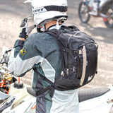 Off-road adventure rider wearing Kriega R15 motorcycle backpack